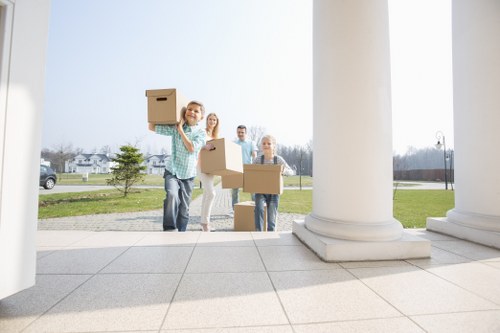 Movers using safe handling methods with protective gear