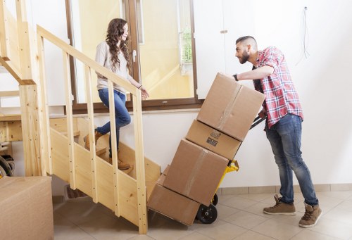 Removal team planning and assessing moving risks inside a property
