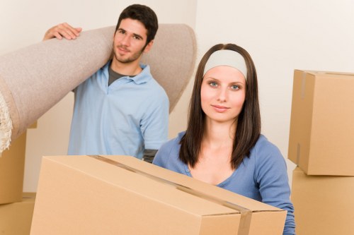 Loading a moving truck in Westminster with furniture and boxes