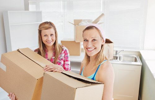 Packed boxes and furniture protection ready for a Westminster home removal