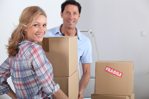 Careful packing of fragile household items in Westminster
