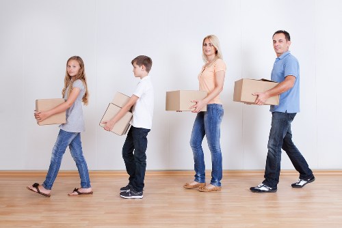 Westminster removals team transporting furniture safely through an urban street