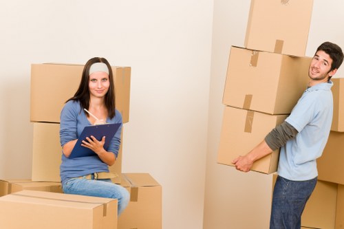 Moving team loading boxes into a removal van in Westminster