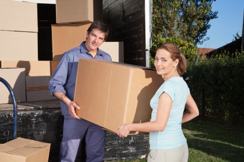 Careful furniture loading into a Westminster removal van